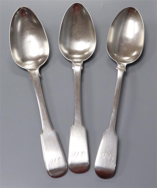 A pair of 19th century Colonial? white metal fiddle pattern table spoons and a George III silver fiddle pattern table spoon,